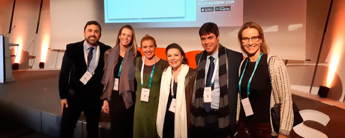 roberto chacur e médicos da clínica leger no imcas 2020 em paris